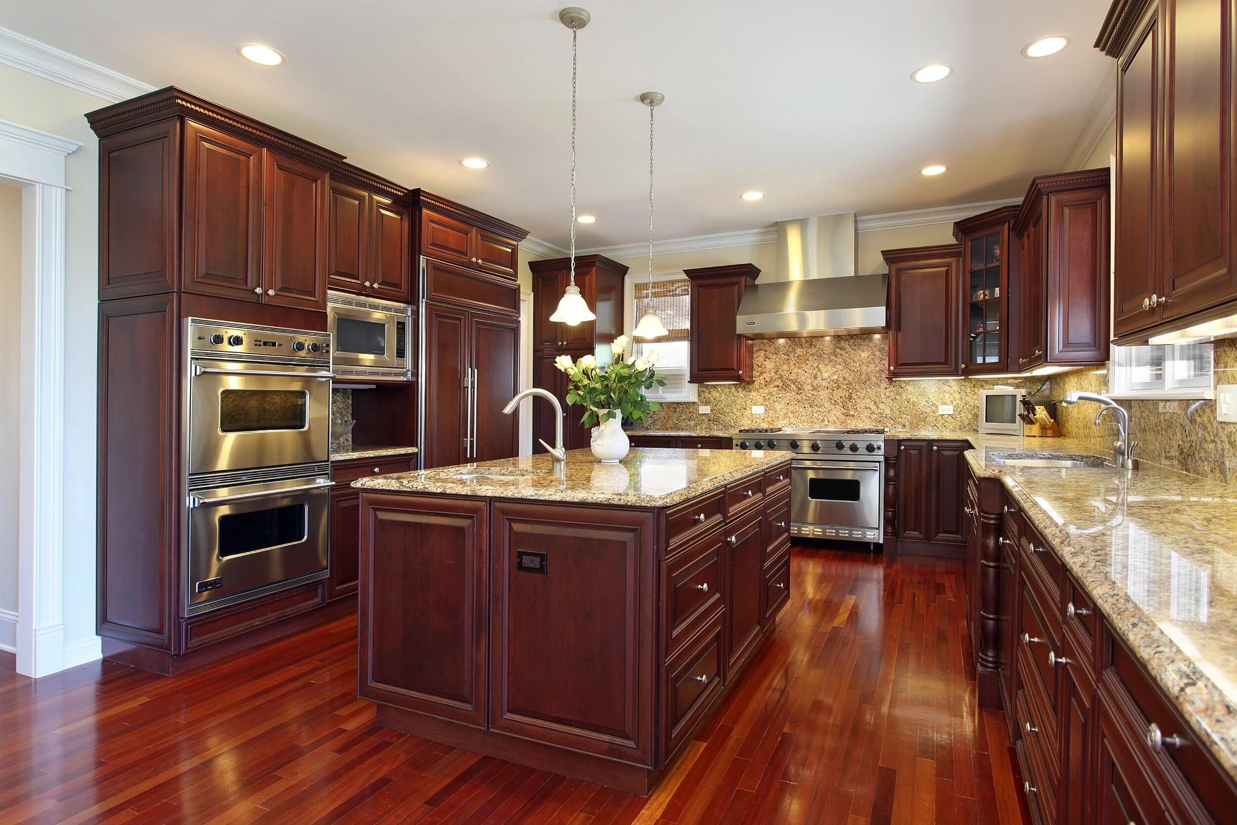 Traditional cabinetry: built-to-order wood cabinets featuring classic design elements such as intricate molding, raised panels, and high-quality finishes.